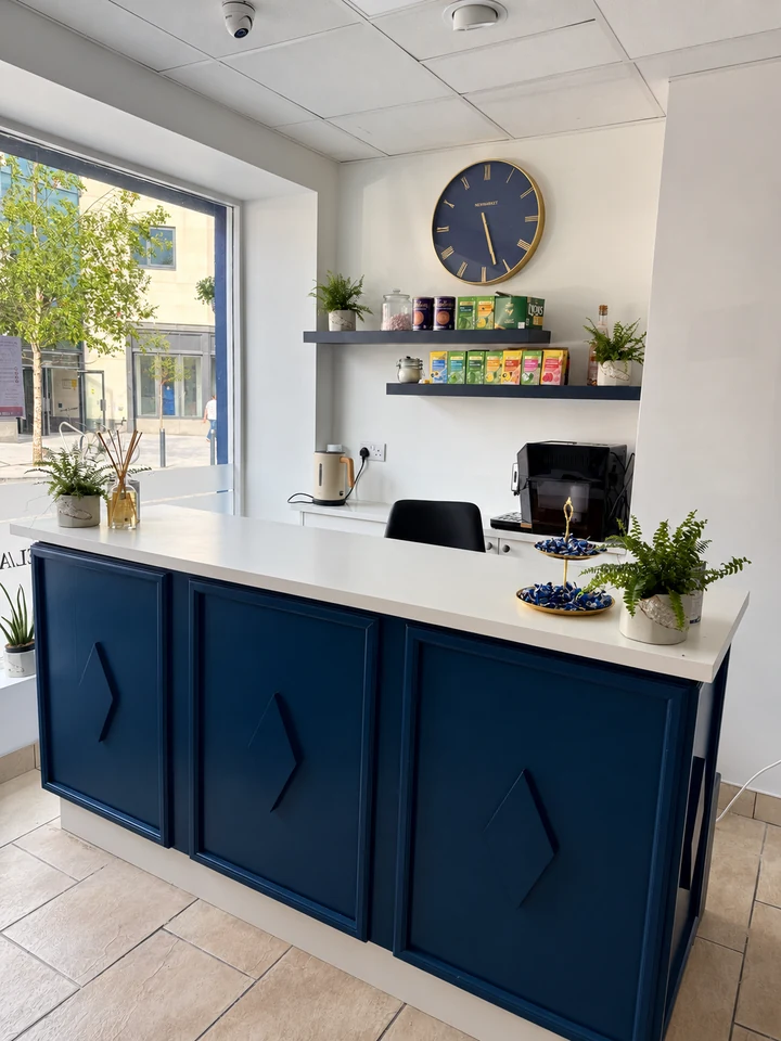 Blue reception desk and refreshments area inside Foxy Nails and Spa Athlone
