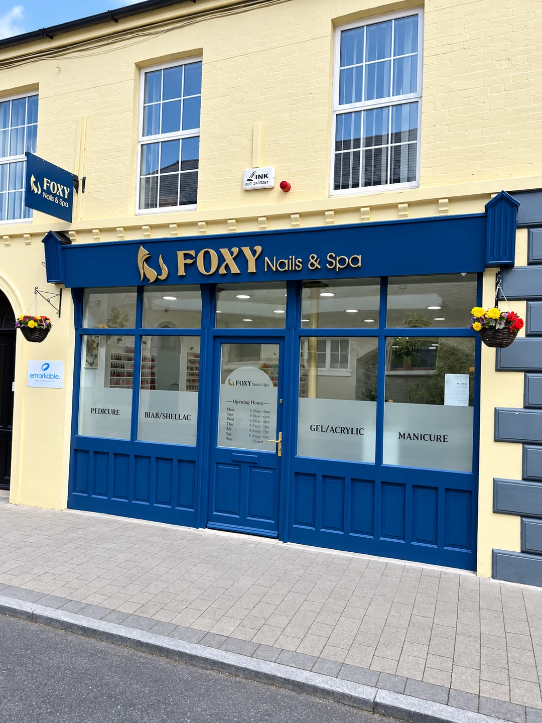 Blue and gold Foxy Nails and Spa storefront in Portarlington
