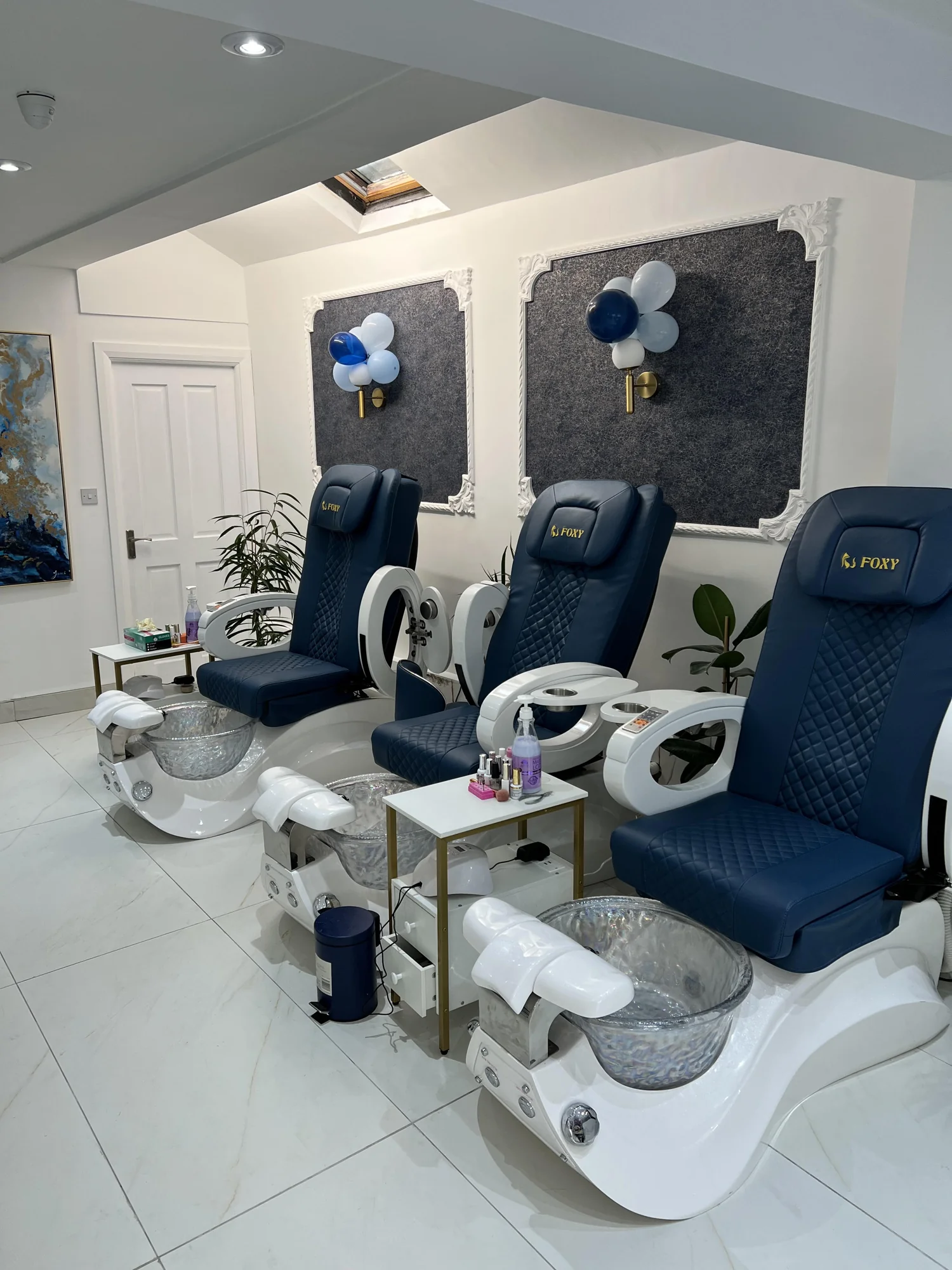 Blue pedicure chairs and spa foot baths inside Foxy Nails and Spa Portlaoise
